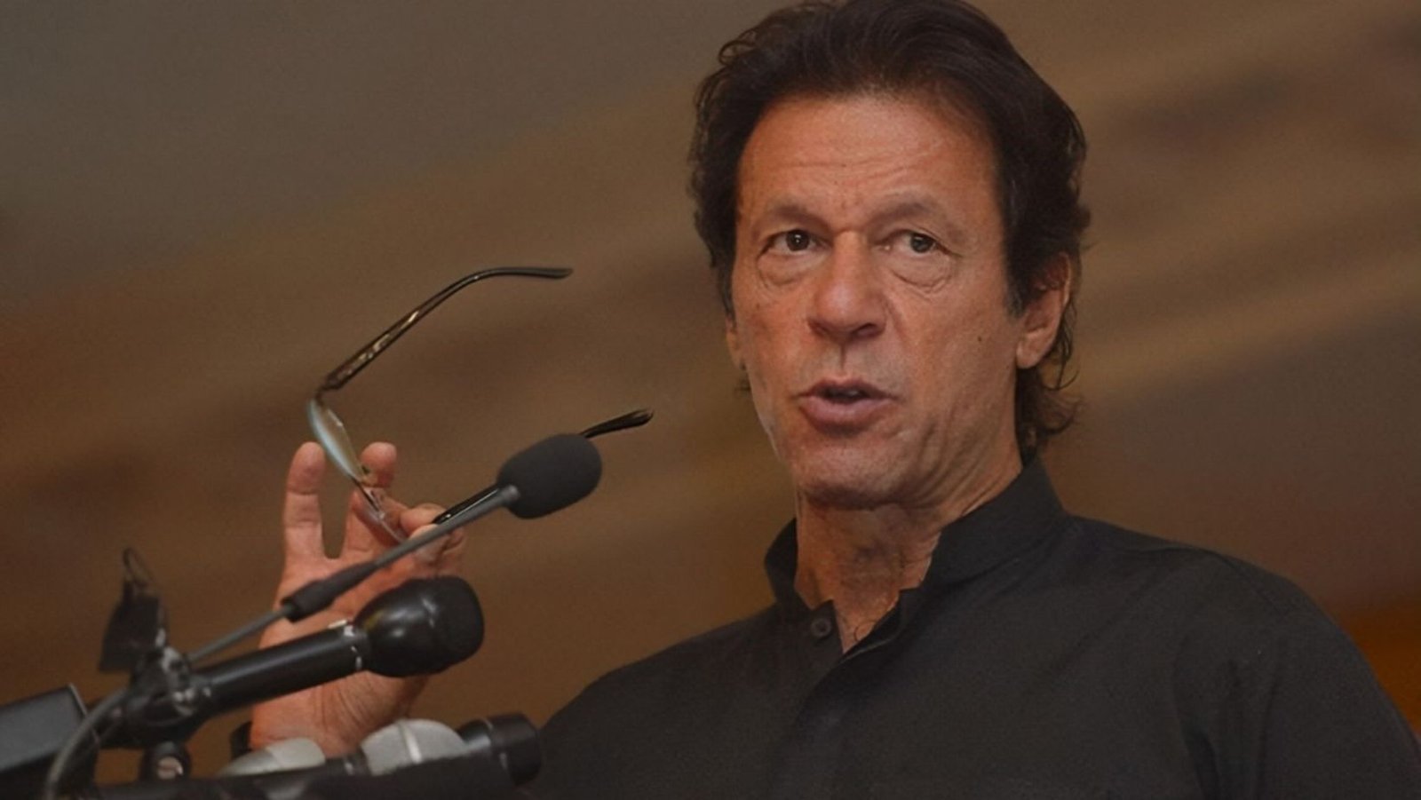 Imran presents his papers for election in each of the nine by-election districts